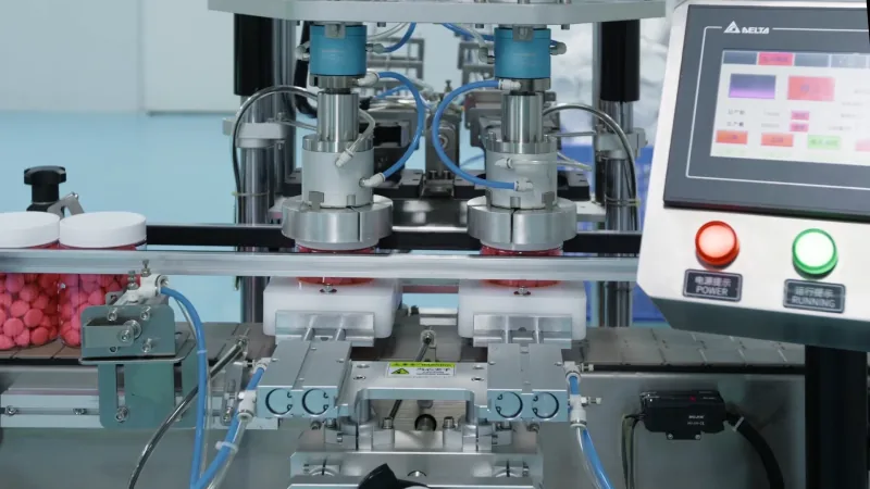 Automated dual-head capping machine with control panel